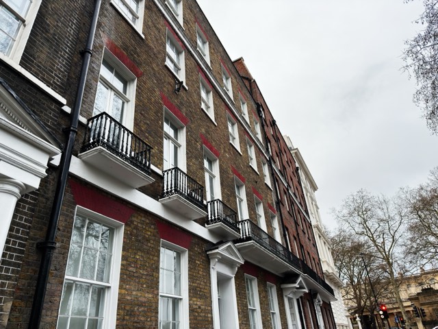Victorian timber sash windows on a London brick terrace